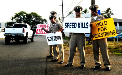 US Navy 100824-N-7498L-180 Chiefs participate in a sign-waving event along Lehua Avenue to raise awareness about driving safely and reducing speed in a school zone