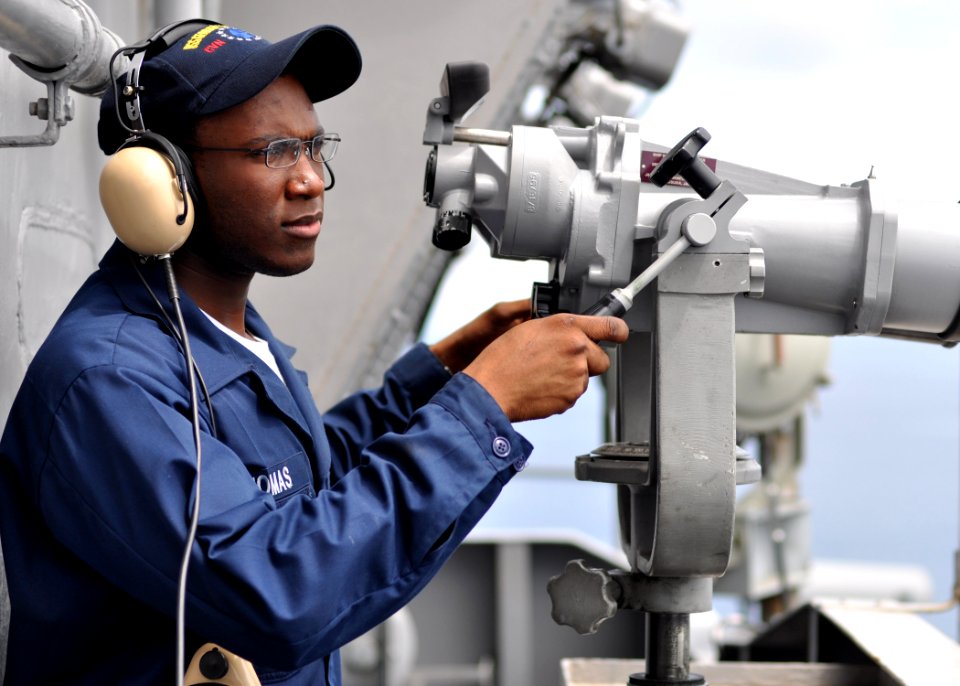 US Navy 100821-N-2013O-040 Logistics Specialist Seaman Stanley Thomas, from Cap-Haitian, Haiti, stands forward lookout watch on the signal bridge of the aircraft carrier USS George Washington (CVN 73)