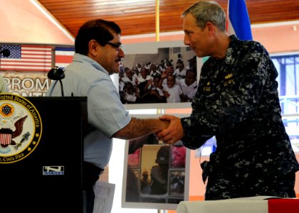 US Navy 100821-N-4153W-151 Capt. Thomas Negus, commodore of Continuing Promise 2010, meets with the mayor of Limon, Costa Rica, Eduardo Barboza, during the opening ceremony for Continuing Promise 2010 photo