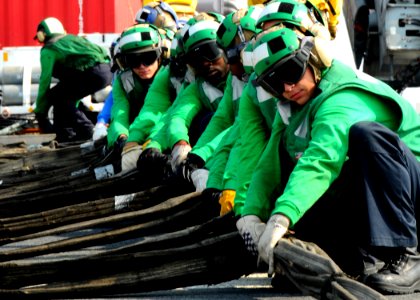 US Navy 100821-N-7908T-108 Sailors assigned to the air department of aircraft carrier USS George H.W. Bush (CVN 77) rig a barricade during flight deck drills