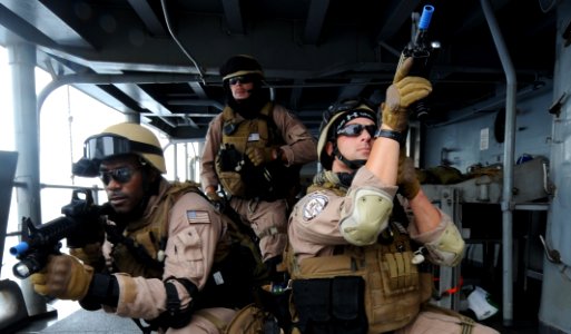 US Navy 100821-N-6463B-323 Members of the U.S. Coast Guard Tactical Law Enforcement take security positions aboard USS Princeton (CG 59) during a mock boarding operation in the Red Sea