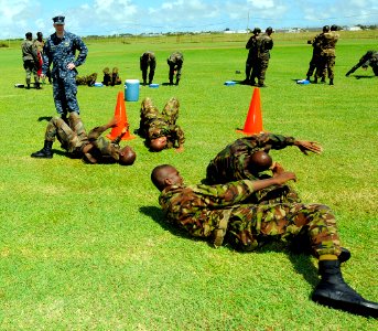 US Navy 100823-N-9643W-581 Lt. j.g. Nicholas Edmiston observes as members of the Barbados Defense Force participate in intensity drills during the Marine Corps martial arts subject matter exchange for Southern Partnership Stati photo
