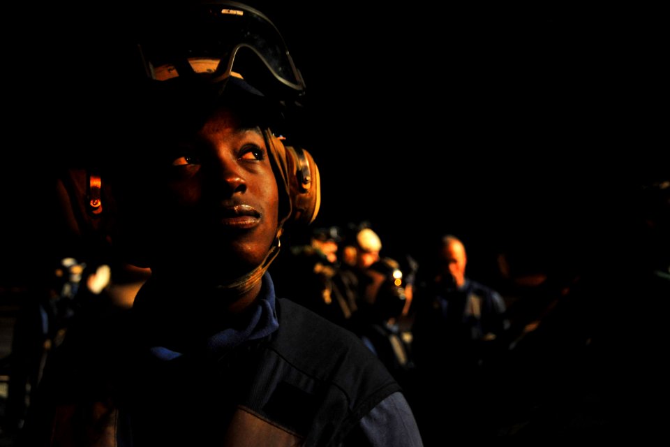 US Navy 100822-N-2953W-316 Aviation Boatswain's Mate Handling Airman Amber Lawson looks up at the moon after a late night fire drill aboard the aircraft carrier USS Carl Vinson (CVN 70)