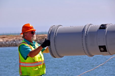 US Navy 100826-N-8951S-067 Navy Ordnance Materials Handler Cliff Mock nspects a Harpoon missile canister prior to loading aboard USS Chancellorsville (CG 62)
