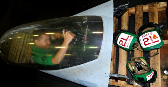 US Navy 100822-N-6427M-014 Cpl. Christopher Stanislawski performs maintenance on an F-A-18C Hornet canopy aboard USS Harry S. Truman (CVN 75)