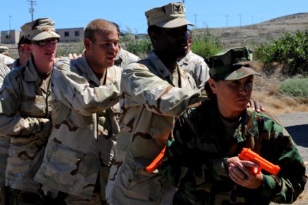 US Navy 100821-N-9123L-039 Sailors prepare to breach a door during a Security Reaction Force training scenario at the Maritime Expeditionary Security Squadron 1 inaugural training school Shark Tank 2010