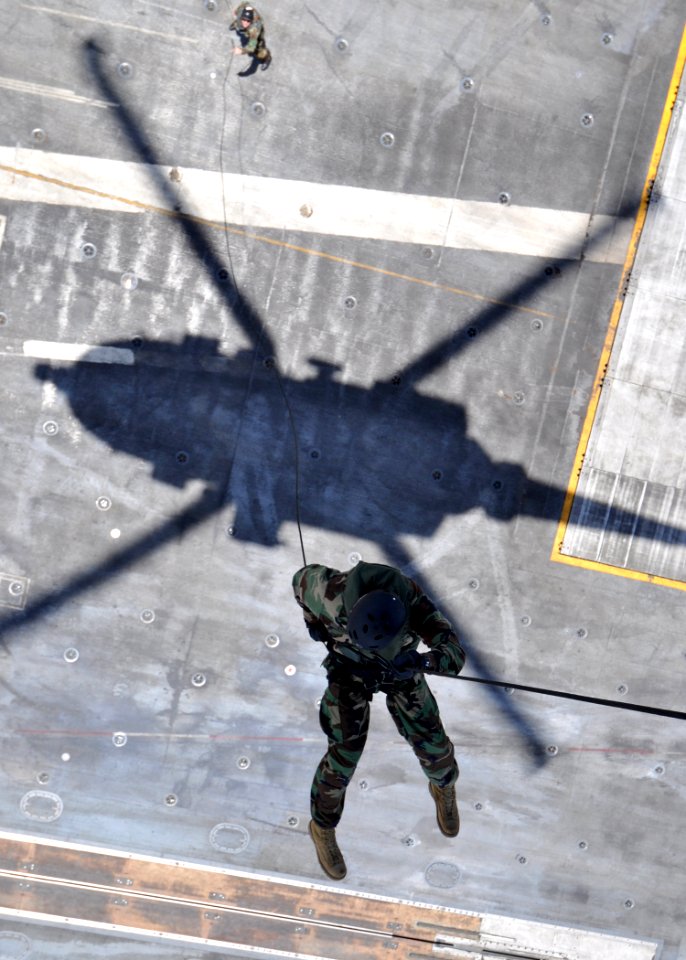 US Navy 100822-N-2013O-081 Lt. Thomas Radich, assigned to Commander Task Force (CTF) 70, rappels from an HH-60H Sea Hawk helicopter