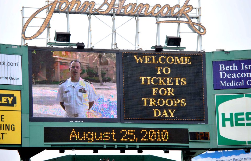 US Navy 100825-N-0413R-120 Cmdr. Matt Graham, stationed in Bahrain, sends his family greetings on the JumboTron during a Boston Red Sox baseball game at Fenway Park