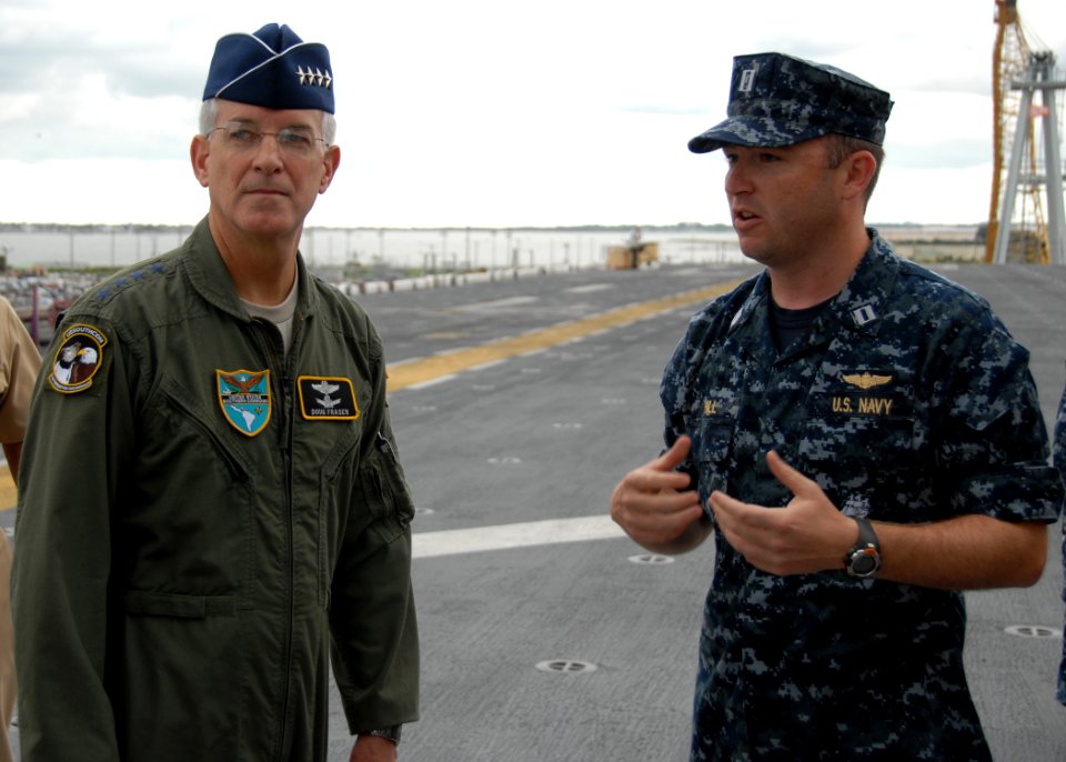 US Navy 100824-N-6764G-145 Lt. Greg Hill explains flight deck operations of USS Kearsarge (LHD 3) to Gen. Douglas Fraser