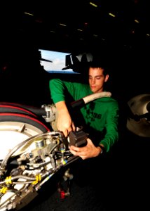 US Navy 100823-N-0569K-023 viation Machinist's Mate 3rd Class Brandon M. Williams changes the transducer on an aerial refueling store