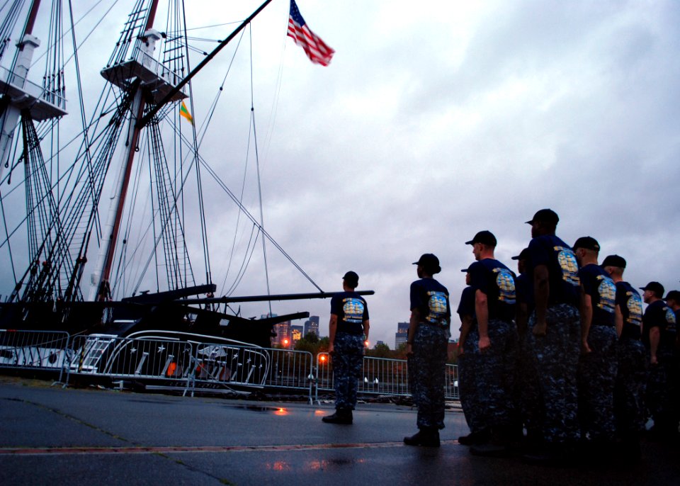US Navy 100823-N-7642M-525 Chief petty officer selects stand at attention waiting for evening colors at USS Constitution during Chief Heritage Week Aug. 23-Sept. 3