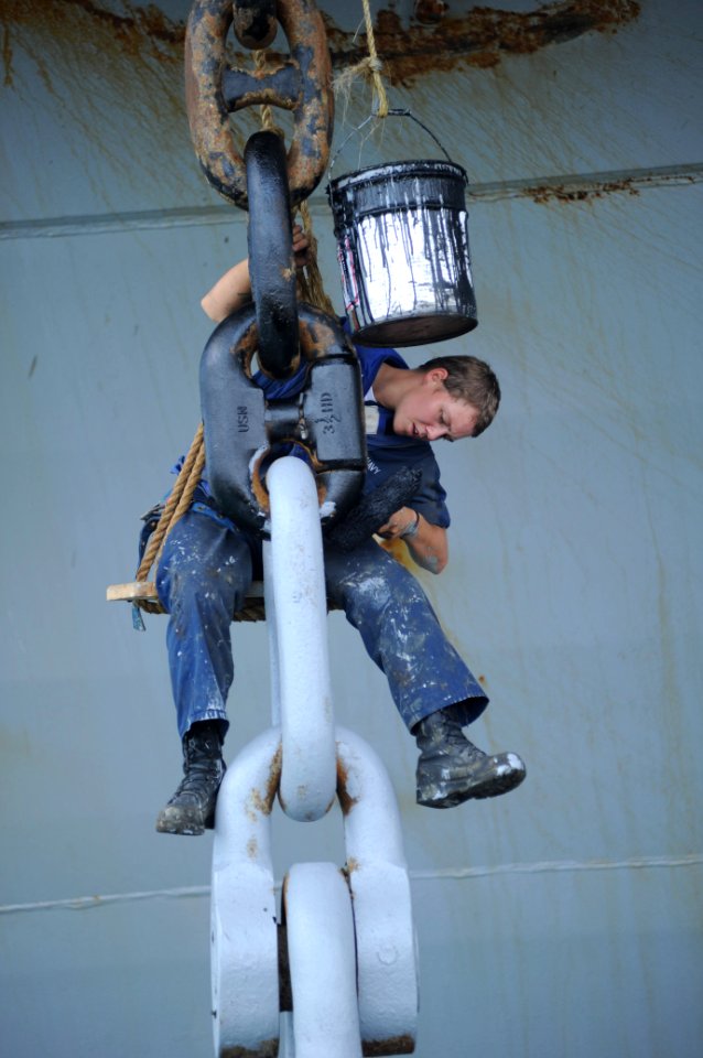US Navy 100823-N-9964S-159 Boatswain's Mate Jacklyn Cravey paints the anchor of the amphibious assault ship USS Iwo Jima (LHD 7) while the ship is ported for operations in Costa Rica