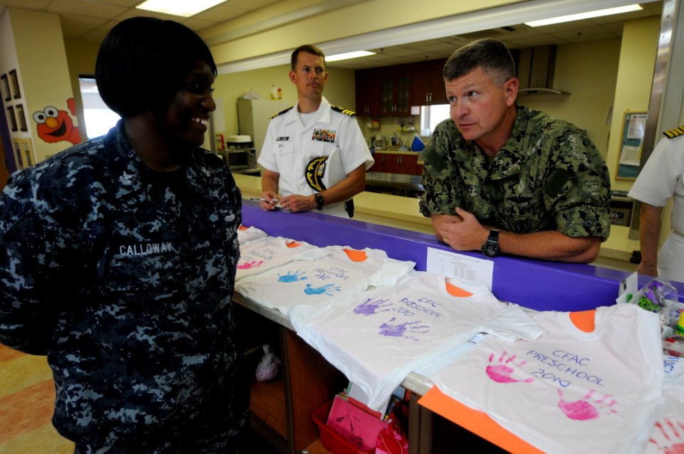 US Navy 100826-N-9818V-710 Master Chief Petty Officer of the Navy (MCPON) Rick West talks with Logistics Specialist 1st Class LaShawna Calloway at the childcare center at Commander, Fleet Activities Chinhae