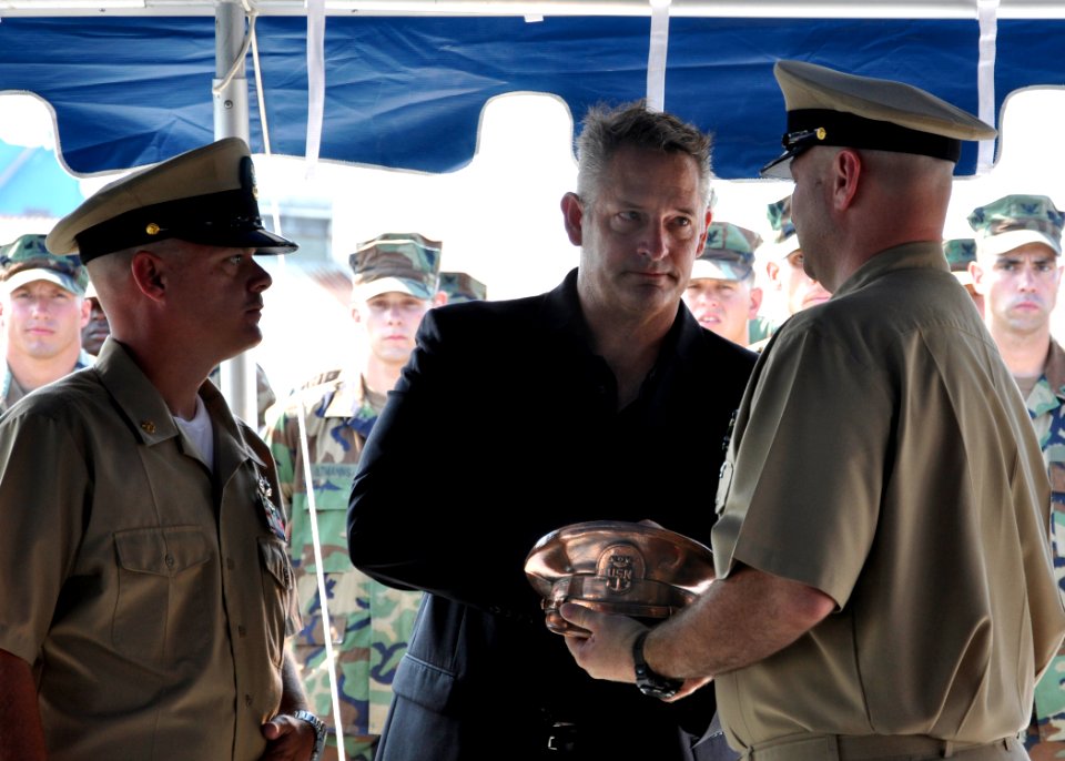 US Navy 100824-N-6692A-005 Retired Chief Boatswain's Mate (SEAL) Kenneth J. Stethem receives a bronzed master chief cover from Chief Intelligence Specialist Dan Mayfield and Chief Cryptologic Technician (Technical) Jeff Kuhlman