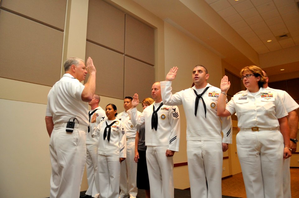 US Navy 100825-N-3548M-105 Chief of Naval Operations (CNO) Adm. Gary Roughead reenlists a group of Sailors after meeting with senior leadership at Buckley Air Force Base in Colorado