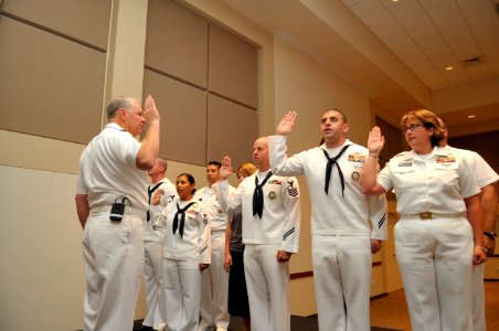 US Navy 100825-N-3548M-105 Chief of Naval Operations (CNO) Adm. Gary Roughead reenlists a group of Sailors after meeting with senior leadership at Buckley Air Force Base in Colorado