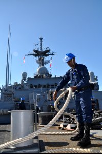 US Navy 100829-N-7293M-061 Navy Boatswain's Mate 3rd Class Michael Ford stows mooring lines on the focsle of the amphibious transport dock ship USS Ponce (LPD 15)