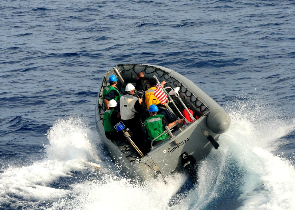 US Navy 100825-N-9301W-307 A rigid hull inflatable boat (RHIB) with search and rescue swimmers from the guided-missile frigate USS Klakring (FFG 42) is launched to recover a MK-46 recoverable exercise torpedo that was launched