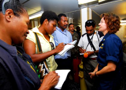 US Navy 100831-N-4044H-236 Lt. Cmdr. Sandra Kimmer, embarked aboard the Royal Australian Navy landing ship heavy HMAS Tobruk (L50), answers questions from media while they tour the ship
