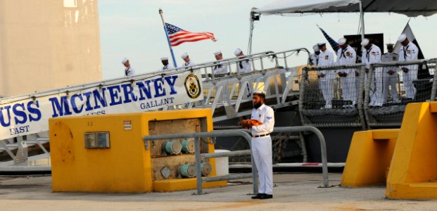 US Navy 100831-N-5812W-006 Sailors assigned to USS McInerney (FFG 8) bow their heads while a Pakistani sailor stands by holding the holy Quran during the invocation of the decommissioning ceremony of USS McInerney (FFG 8)