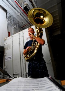 US Navy 100828-N-4044H-038 Musician 1st Class Eric Snitzer practices his instrument during the ship's transit to Papua New Guinea to support Pacific Partnership 2010