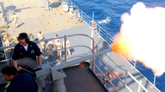 US Navy 100829-N-0864H-900 Gunner's Mate 1st Class James Carter and Gunner's Mate 3rd Class Chad Thomes test fire a 40mm saluting battery aboard the U.S. 7th Fleet command ship USS Blue Ridge (LCC 19)