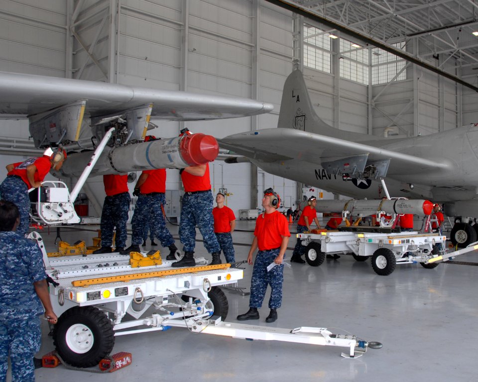 US Navy 100831-N-8490W-005 An aviation ordnance team load a captive-carry MK-84 Harpoon training missile onto a P-3C Orion at Naval Air Station Jacksonville