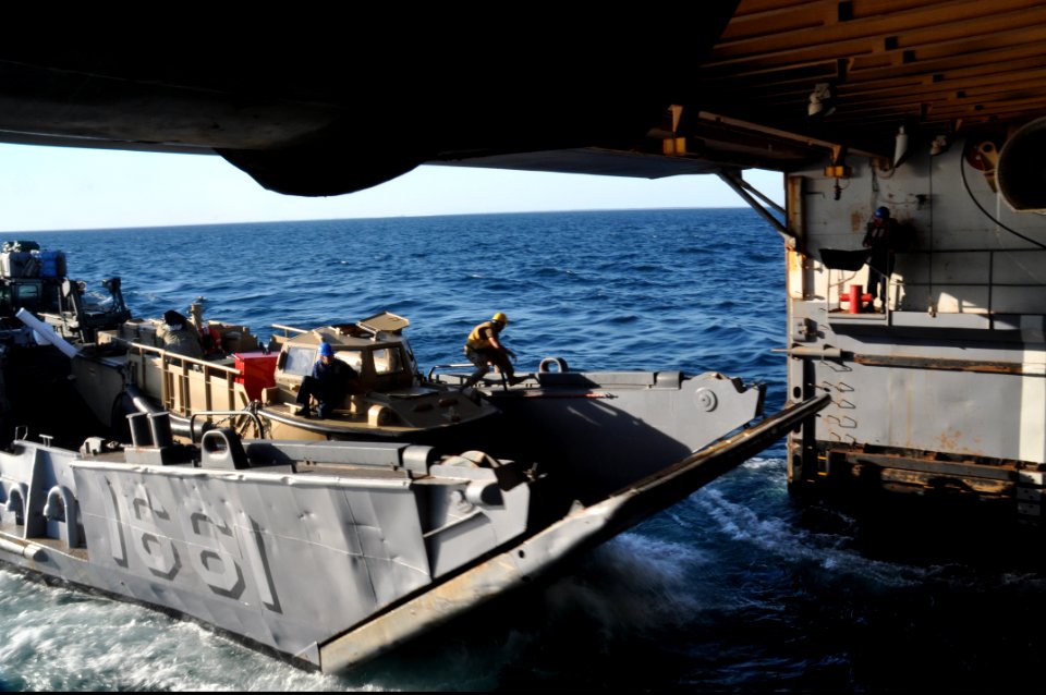US Navy 100829-N-7293M-109 A landing craft utility enters the well deck of the amphibious transport dock ship USS Ponce (LPD 15) after the ship got underway from Morehead City, N.C