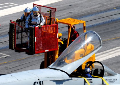 US Navy 100829-N-6632S-006 Sailors assigned to the air department crash and salvage division aboard the aircraft carrier USS George H.W. Bush (CVN 77) simulate extracting a pilot from a plane during a mass casualty drill