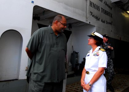 US Navy 100831-N-4044H-164 Teddy Taylor and Capt. Lisa M. Franchetti talk as he arrives aboard the Royal Australian Navy landing ship heavy HMAS Tobruk (L50)