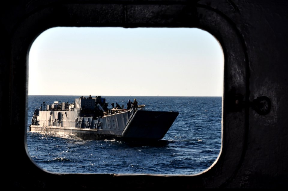 US Navy 100829-N-7293M-091 A landing craft utility prepares to enter the well deck of the amphibious transport dock ship USS Ponce (LPD 15) after the ship got underway from Morehead City, N.C