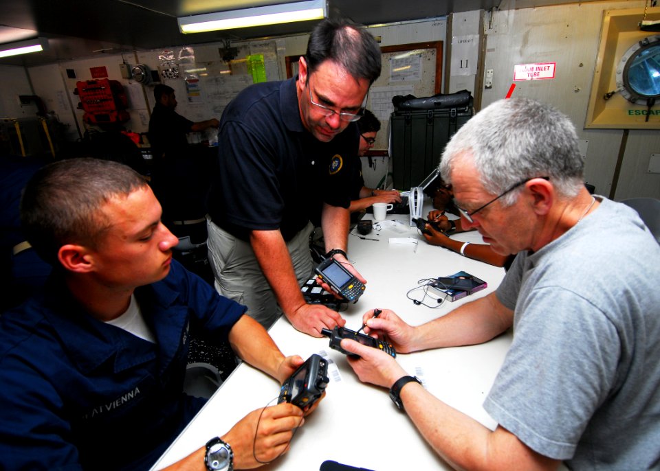 US Navy 100830-N-4044H-052 J. Mike Roach, a Civil Humanitarian Information Management Expeditionary (CHIME) operator, familiarizes sailors with the CHIME system while aboard the Royal Australian Navy landing ship heavy HMAS To