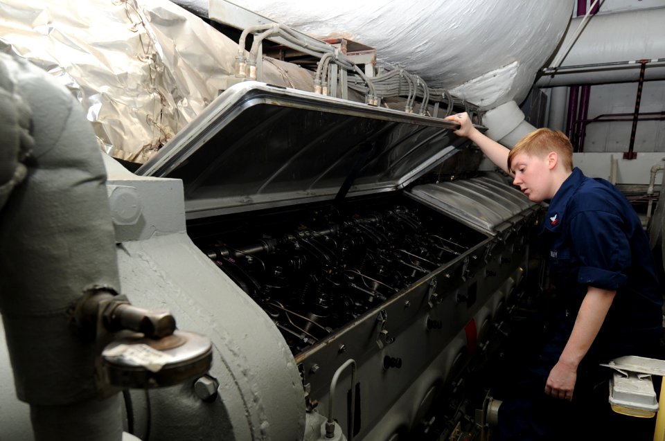 US Navy 100831-N-7191M-026 Engineman 2nd Class Brittany Davidson checks the fuel rack cylinders for adequate lubrication in the forward emergency diesel generator aboard USS George Washington (CVN 73)