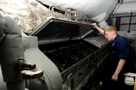 US Navy 100831-N-7191M-026 Engineman 2nd Class Brittany Davidson checks the fuel rack cylinders for adequate lubrication in the forward emergency diesel generator aboard USS George Washington (CVN 73)