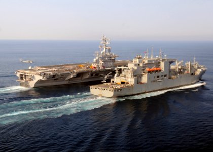 US Navy 100901-N-3885H-150 The Military Sealift Command dry cargo and ammunition ship USNS Robert E. Peary (T-AKE 5) and the aircraft carrier USS Dwight D. Eisenhower (CVN 69) conduct a vertical replenishment