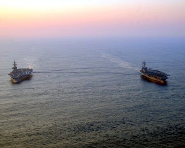 US Navy 100831-N-3885H-019 The aircraft carriers USS George H.W. Bush (CVN 77) and USS Dwight D. Eisenhower (CVN 69) conduct a vertical replenishment