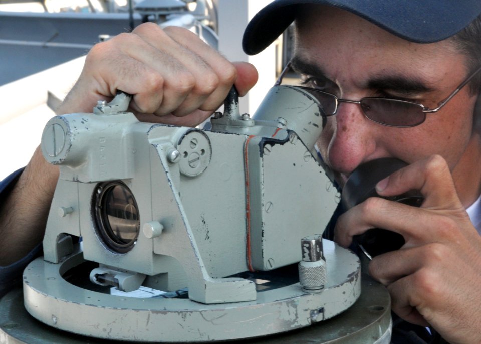 US Navy 100831-N-3620B-061 Quartermaster 3rd Class Michael R. Reilly uses an alidade aboard USS Denver (LPD 9) to verify the ship's bearing as it departs Fleet Activities Yokosuka