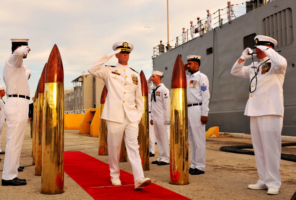 US Navy 100831-N-8590G-003 Cmdr. Paul D. Young is piped through the side boys during the decommissioning ceremony of USS McInerney (FFG 8)