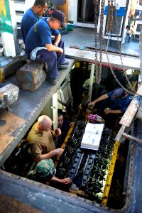 US Navy 100831-N-8546L-288 Sailors assigned to Maritime Civil Affairs and Security Training (MCAST) command teach Costa Rican coast guard sailors how to time a 3412 series Caterpillar boat engine