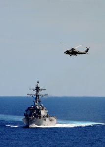 US Navy 100905-N-0569K-013 An HH-60H Sea Hawk helicopter flies over USS Bulkeley (DDG 84) photo