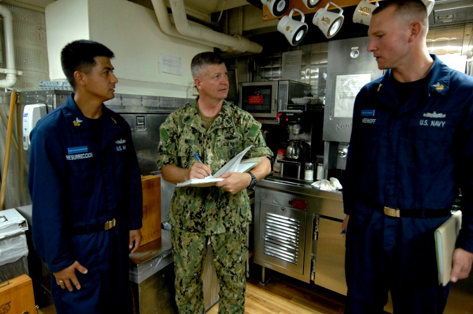 US Navy 100831-N-9818V-711 Master Chief Petty Officer of the Navy (MCPON) Rick West signs the charge books for chief selects