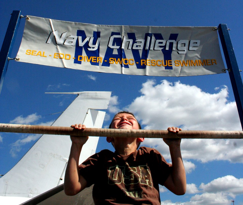 US Navy 100905-N-6220J-111 A visitor to the Cleveland National Air Show attempts the Navy Challenge pull-ups