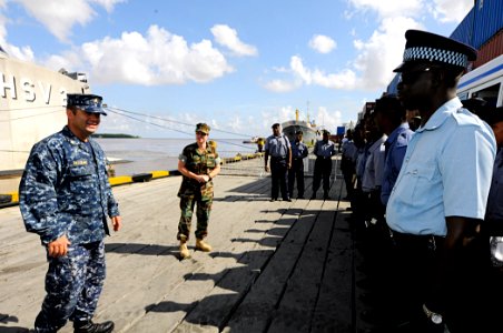 US Navy 100831-N-9643W-246 Chief Master-at-Arms Jose Del Olmo, left, and Chief Hospital Corpsman Tracie Ham greet members of the Guyana Defense Force before the start of subject matter expert exchanges aboard High Speed Vessel