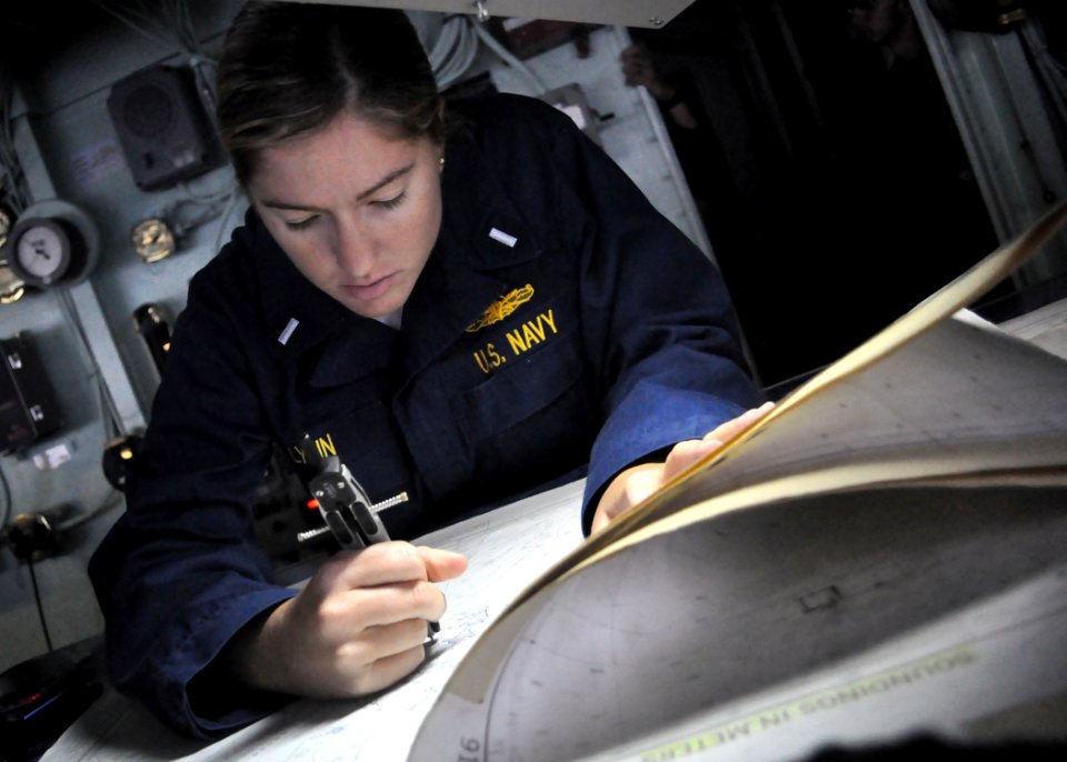 US Navy 100904-N-3620B-018 Lt. j.g. Brittany Lynn plots a course to an anchorage point from the pilothouse of USS Denver (LPD 9)
