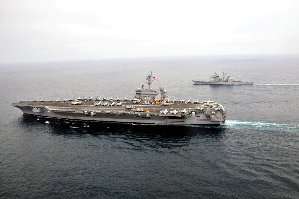 US Navy 100901-N-2953W-492 The Nimitz-class aircraft carrier USS Carl Vinson (CVN 70) performs tactical maneuvering exercises with the guided-missile cruiser USS Bunker Hill (CG 52)