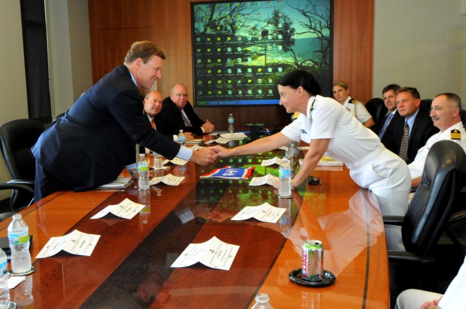 US Navy 100902-N-6736S-018 Rear Adm. Wendi B. Carpenter, commander of Navy Warfare Development Command, meets with the CEO of Sherwin-Williams and his staff to thank them for their support of the Navy