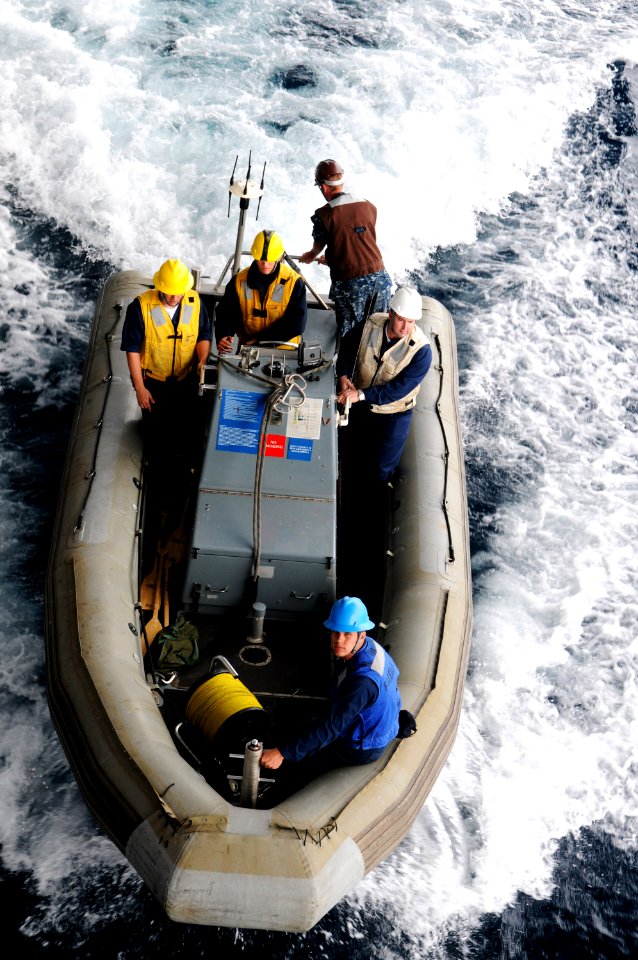 US Navy 100908-N-0232G-176 Boatswain's Mate 3rd Class Jordan Springer pilots the rigid-hull inflatable boat alongside USS Ronald Reagan (CVN 76)