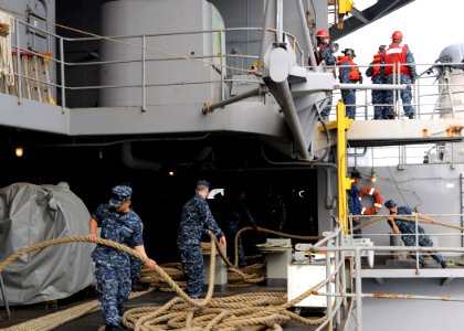 US Navy 100907-N-4973M-067 Sailors aboard the aircraft carrier USS Abraham Lincoln (CVN 72) heave mooring lines prior to departing homeport for a s