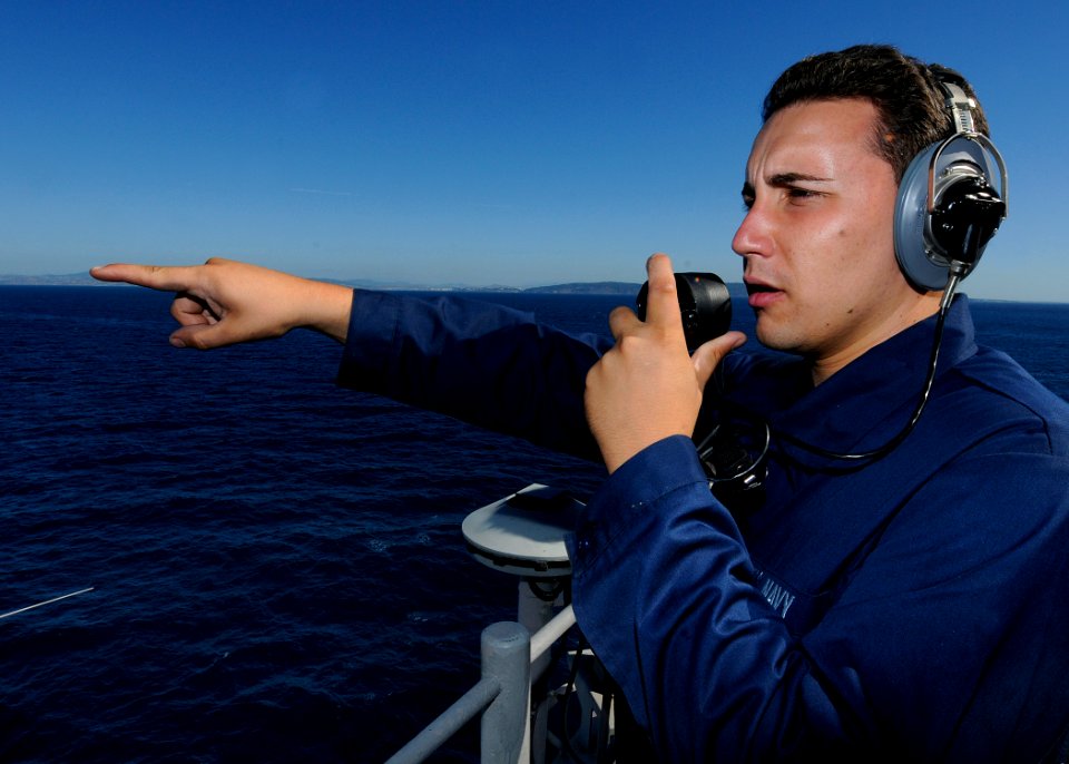 US Navy 100908-N-3154P-023 Seaman Apprentice James Anthony stands lookout watch aboard USS Kearsarge (LHD 3) as the ship transits the Strait of Gib
