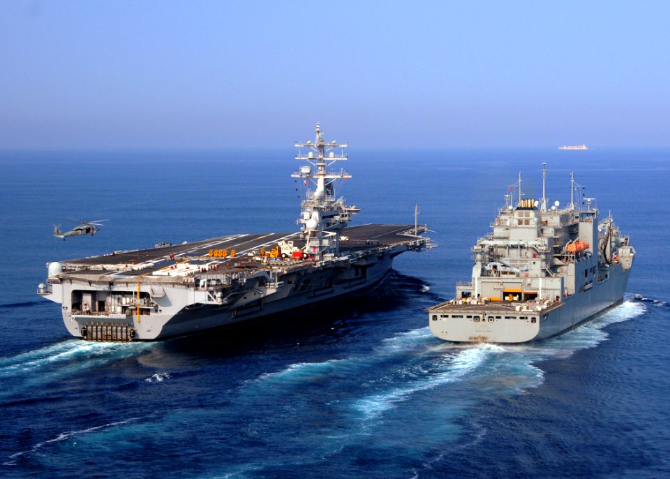 US Navy 100901-N-9793B-031 The aircraft carrier USS Dwight D. Eisenhower (CVN 69) and the Military Sealift Command dry cargo and ammunition ship USNS Robert E. Peary (T-AKE 5) conduct a vertical replenishment